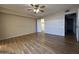 Spacious bedroom featuring sleek wood floors, a ceiling fan, and ample natural light at 1733 N Miller Rd, Scottsdale, AZ 85257