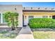 Inviting home exterior featuring a well-maintained lawn, mature landscaping, and a clearly marked address at 1733 N Miller Rd, Scottsdale, AZ 85257