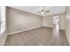 Bright and airy living room featuring tiled floors, neutral paint, and ample space at 1733 N Miller Rd, Scottsdale, AZ 85257