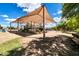 Shaded playground with multiple slides, climbing structures and a bench at 1733 N Miller Rd, Scottsdale, AZ 85257