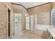 Bathroom features a shower, soaking tub, neutral tile, and classic gold hardware at 1896 E Stephens Dr, Tempe, AZ 85283