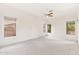 Bright bedroom with multiple windows, carpeted flooring, and neutral walls at 1896 E Stephens Dr, Tempe, AZ 85283