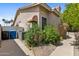 The exterior of this home is enhanced by mature landscaping and a convenient side walkway at 1896 E Stephens Dr, Tempe, AZ 85283