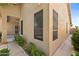 This home features large screened windows that bring in natural light and air, along with mature landscaping at 1896 E Stephens Dr, Tempe, AZ 85283