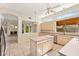 Well-lit kitchen with an island, tile floors, and views into the living room and backyard at 1896 E Stephens Dr, Tempe, AZ 85283