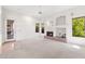 Spacious living room with bright light, fireplace, white walls and tile/carpet flooring at 1896 E Stephens Dr, Tempe, AZ 85283