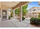 Covered patio with ceiling fan, landscaping, and view of the backyard water feature at 1896 E Stephens Dr, Tempe, AZ 85283
