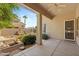 Covered patio with ceiling fan, landscaping, and view of the backyard water feature at 1896 E Stephens Dr, Tempe, AZ 85283