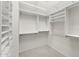Bright walk-in closet with custom shelving and carpeted flooring for optimal storage at 1896 E Stephens Dr, Tempe, AZ 85283