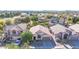 Overhead shot of a house in a well-maintained neighborhood with nearby green spaces and mountains at 19824 N 14Th Pl, Phoenix, AZ 85024