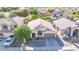 Aerial shot of the house, showing the surrounding neighborhood with mature trees at 19824 N 14Th Pl, Phoenix, AZ 85024