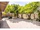 Spacious backyard with brick pavers, mature trees, and a tranquil atmosphere for outdoor enjoyment at 19824 N 14Th Pl, Phoenix, AZ 85024