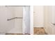 Bright bathroom featuring a accessible walk-in shower with a curtain for privacy at 19824 N 14Th Pl, Phoenix, AZ 85024