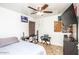 Well-lit bedroom featuring neutral walls, a ceiling fan, and a cozy atmosphere for relaxation and rest at 19824 N 14Th Pl, Phoenix, AZ 85024