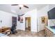 Inviting bedroom with a wheelchair, stylish flooring, and arched doorway, offering accessibility and comfort at 19824 N 14Th Pl, Phoenix, AZ 85024