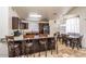 Kitchen featuring a breakfast bar with seating and connected dining area in an open floorplan at 19824 N 14Th Pl, Phoenix, AZ 85024