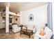Bright living room featuring open layout, travertine floors, neutral walls, and stylish, comfortable furniture at 19824 N 14Th Pl, Phoenix, AZ 85024