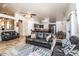 Spacious open floorplan connecting the kitchen, dining area, and living room with vaulted ceilings at 19824 N 14Th Pl, Phoenix, AZ 85024