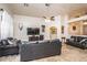 Spacious living room featuring bar area, vaulted ceilings and travertine flooring at 19824 N 14Th Pl, Phoenix, AZ 85024