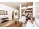 Open-concept living space with beautiful travertine floors, neutral paint, and bright, connected dining area at 19824 N 14Th Pl, Phoenix, AZ 85024