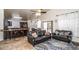 Open-concept space featuring bar seating, a cozy living area and an adjacent dining space at 19824 N 14Th Pl, Phoenix, AZ 85024