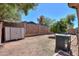 An open backyard with a storage shed and a well maintained air conditioning unit on a sunny day at 1983 W Allens Peak Rd, Queen Creek, AZ 85144