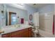 Bathroom with a single sink vanity, framed mirror, updated fixtures, and a bathtub-shower combination at 1983 W Allens Peak Rd, Queen Creek, AZ 85144