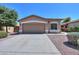 Home featuring desert landscaping, a two-car garage, and a well-maintained front yard at 1983 W Allens Peak Rd, Queen Creek, AZ 85144