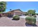 Charming single-story home with a two-car garage, desert landscaping, and a well-maintained exterior at 1983 W Allens Peak Rd, Queen Creek, AZ 85144