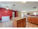 Spacious kitchen with tile flooring, oak cabinets, and a kitchen island with a sink at 1983 W Allens Peak Rd, Queen Creek, AZ 85144