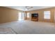 Comfortable living room featuring a sliding glass door and a ceiling fan at 1983 W Allens Peak Rd, Queen Creek, AZ 85144