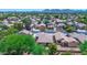 An aerial view of a residential neighborhood with tree-lined streets and a mountain view at 21050 E Tierra Grande --, Queen Creek, AZ 85142