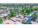 An aerial view of a residential neighborhood with tree-lined streets and a community pool at 21050 E Tierra Grande --, Queen Creek, AZ 85142