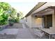 Serene backyard featuring a covered patio, lush vegetation, and well-maintained landscaping at 21050 E Tierra Grande --, Queen Creek, AZ 85142