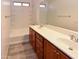 Bright bathroom with double sinks, a large mirror, a bathtub and shower, and tile flooring at 21050 E Tierra Grande --, Queen Creek, AZ 85142