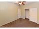 Bedroom featuring sliding closet doors, carpet, a ceiling fan and neutral wall paint at 21050 E Tierra Grande --, Queen Creek, AZ 85142