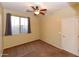 Bedroom featuring neutral wall paint, carpet, a ceiling fan, and a window with curtains at 21050 E Tierra Grande --, Queen Creek, AZ 85142