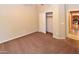 Carpeted bedroom with closet featuring sliding doors, neutral wall paint and kitchen view at 21050 E Tierra Grande --, Queen Creek, AZ 85142