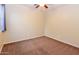 Carpeted bedroom featuring a ceiling fan and neutral wall paint at 21050 E Tierra Grande --, Queen Creek, AZ 85142