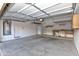 Spacious garage providing ample storage and parking space, including a water heater and shelving at 21050 E Tierra Grande --, Queen Creek, AZ 85142