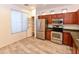 Well-equipped kitchen with stainless steel appliances, pantry, natural light, and ample cabinet space at 21050 E Tierra Grande --, Queen Creek, AZ 85142