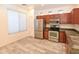 Efficient kitchen featuring stainless steel appliances, abundant cabinet space, and modern flooring at 21050 E Tierra Grande --, Queen Creek, AZ 85142