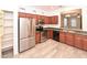 Modern kitchen with stainless steel appliances, wooden cabinets, and a convenient layout for cooking and entertaining at 21050 E Tierra Grande --, Queen Creek, AZ 85142