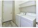 Practical laundry room with shelving and modern washer and dryer units for convenience at 21050 E Tierra Grande --, Queen Creek, AZ 85142