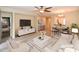 An open-concept living room with hardwood floors and a dining area at 21050 E Tierra Grande --, Queen Creek, AZ 85142