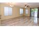 Bright, open-concept living area with modern floors, large windows, and a seamless flow to the outdoors at 21050 E Tierra Grande --, Queen Creek, AZ 85142