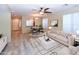 An open-concept living room with hardwood floors and a dining area at 21050 E Tierra Grande --, Queen Creek, AZ 85142