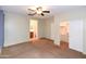 Spacious main bedroom with ceiling fan, ensuite bathroom, and a convenient walk-in closet at 21050 E Tierra Grande --, Queen Creek, AZ 85142