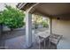 Charming outdoor patio featuring brick pavers, comfortable seating, and views of the landscaped backyard and mature trees at 21050 E Tierra Grande --, Queen Creek, AZ 85142
