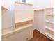 Organized walk-in closet with shelving, providing ample storage space for clothing and accessories at 21050 E Tierra Grande --, Queen Creek, AZ 85142
